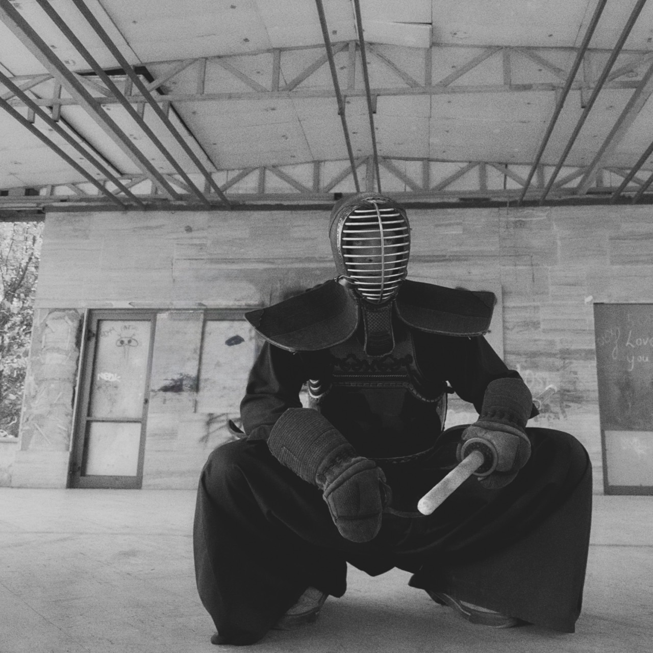ivan seated in kendo armor, facing the camera
